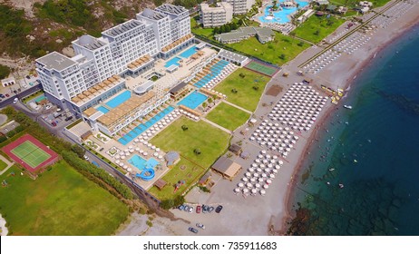 Aerial Birds Eye View Photo Taken By Drone Of Luxury Resort Of Alila - Mitsis Group In Crowded Iconic Beach Of Kalithea, Rodos Island, Greece