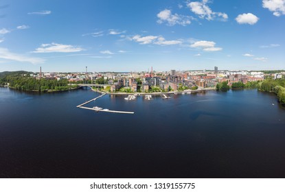 Aerial birds eye view of the Tampere city at sunny summer day in Finland. In the foreground is the new Ratina residential area and on the left the Etelapuisto and Pyynikinharju
