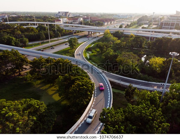 Aerial Bird\'s-eye\
view photo from flying drone of a Road traffic an important\
infrastructure in\
Thailand.