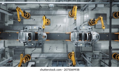 Aerial Car Factory 3D Concept: Automated Robot Arm Assembly Line Manufacturing Advanced High-Tech Green Energy Electric Vehicles. Construction, Building, Welding Industrial Production Conveyor - Shutterstock ID 2075069938