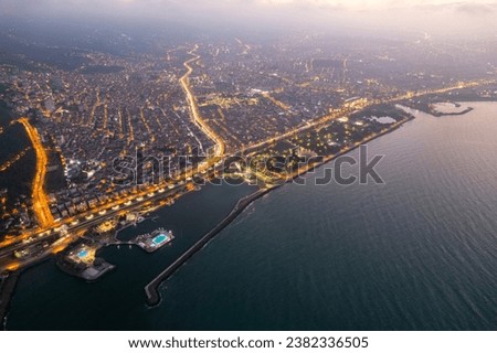 Aerial city center and port at night. Samsun, Turkey
