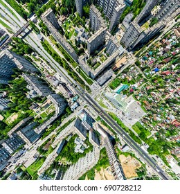 Aerial city view with crossroads and roads, houses, buildings, parks and parking lots, bridges. Helicopter drone shot. Wide Panoramic image. - Shutterstock ID 690728212