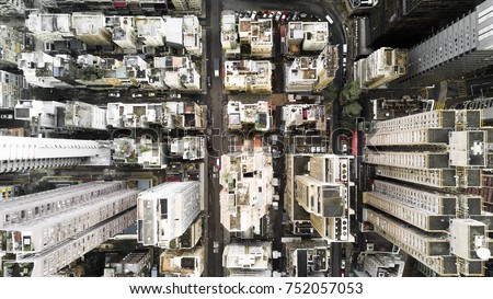Aerial city view with crossroads and roads, houses, buildings and parking lots. Helicopter drone shot. Wide Panoramic image.