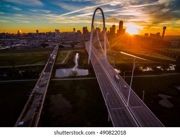 Aerial Cityscape At Sunrise In Dallas Texas With Star Burst Over Landmark Bridge With Dtown Skyline In The Background With Colorful Morning Sunshine