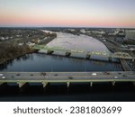 An aerial of the cityscape of Trenton, New Jersey, cars driving along the highways at sunrise