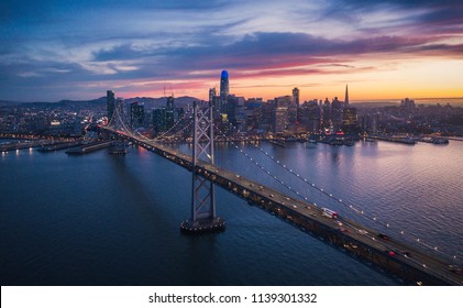 Aerial Cityscape view of San Francisco and the Bay Bridge with Colorful Sunset, California, USA