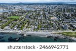 aerial cityscape view of Victoria, the capital of British Columbia, from Pacific, across James Bay district in front,  Downtown, Burnside and Victoria West in background 