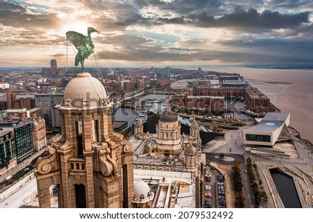 Aerial close up of the tower of the Royal Liver Building in Liverpool, UK during beautiful sunset.
