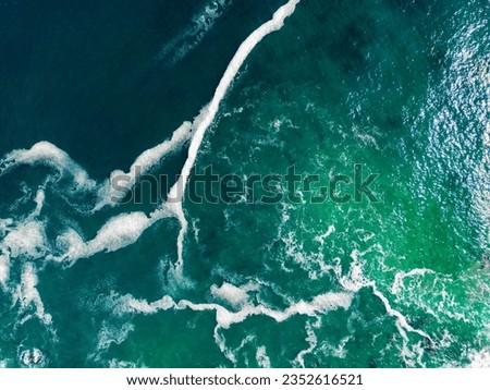 Aerial close up of the turquoise sea at the coast of the National Park Pan de Azúcar in the Atacama desert in Chile - Traveling South America