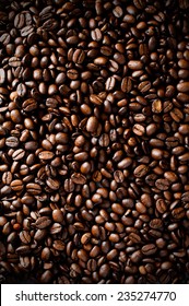 Aerial close-up of Arabica, Barista dark roasted coffee beans.