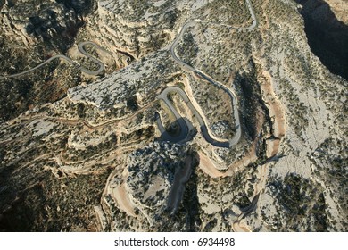 Aerial Of Curvy Road In High Desert Landscape Of Utah, USA.