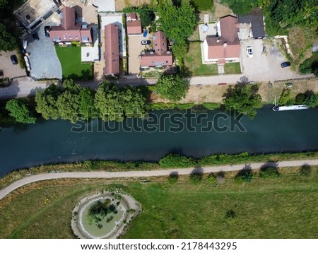 Aerial down shot of river and beautiful houses in Hertford UK