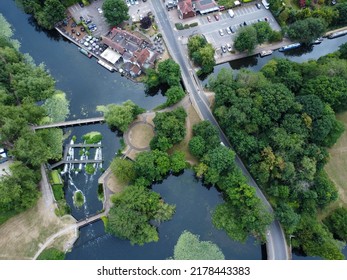 Aerial Downward Shot Of Pub And Road On The River In Hertfordshire With A Weir