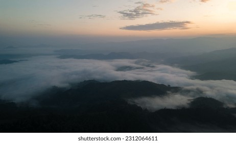 Aerial dramatic sunrise Mountains nature fog cloud sunlight. - Shutterstock ID 2312064611