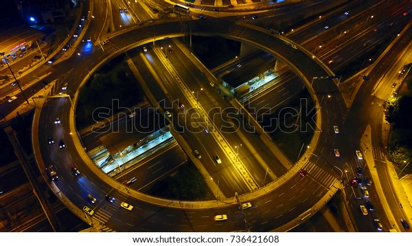 Aerial\
drone bird\'s eye night photo of ring road at\
night