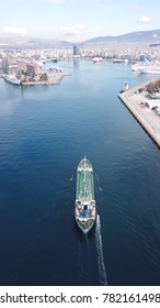 Aerial Drone, Bird's Eye Photo Of Industrial Tanker Ship Entering Famous Port Of Peiraeus, One Of The Largest In Europe, Attica, Greece