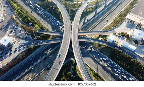 Aerial Drone Bird's Eye View Photo Of Latest Technology Cross Shape Multi Level Road Highway Passing Through City Center