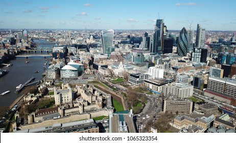 Aerial Drone Bird's Eye View Of Iconic Tower Of London And Skyline Of City Of London Next To River Thames, United Kingdom