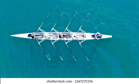 Aerial Drone Bird's Eye View Of Sport Canoe Operated By Team Of Young Men