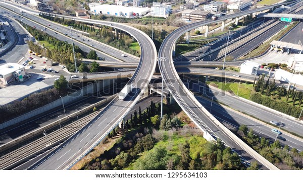 Aerial\
drone bird\'s eye view photo of latest technology cross shape multi\
level road highway passing through city\
center