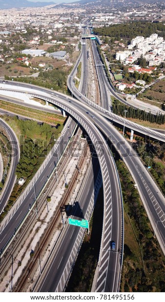 Aerial drone\
bird\'s eye view of popular highway of Attiki Odos ring road,\
passing through Spata Avenue, Attica,\
Greece