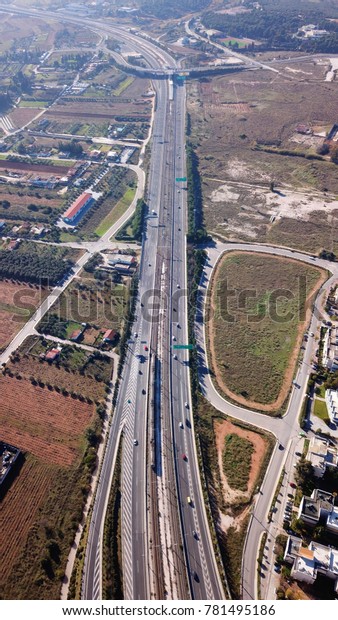 Aerial drone\
bird\'s eye view of popular highway of Attiki Odos ring road,\
passing through Spata Avenue, Attica,\
Greece