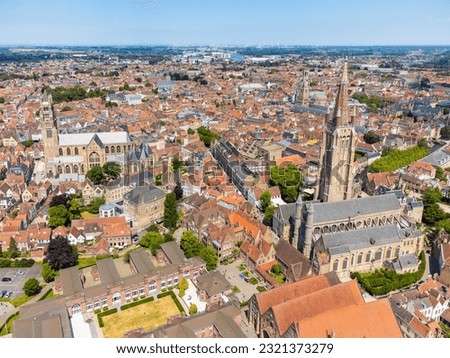 Aerial drone cityscape with the Notre Dame (Our Lady) church of Bruges and the St. Salvator's Cathedral (Saint Savior), the Roman Catholic cathedral and main church of Bruges, Belgium. 