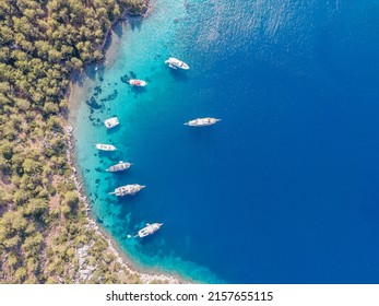 Aerial Drone Footage Of Daily Tour Boats And Private Yachts Anchored In Cennet Bay, Located In Selimiye Village Of Marmaris District Of Muğla City, Turkey.