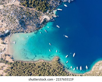 Aerial Drone Footage Of Daily Tour Boats And Private Yachts Anchored In Cennet Bay, Located In Selimiye Village Of Marmaris District Of Muğla City, Turkey.