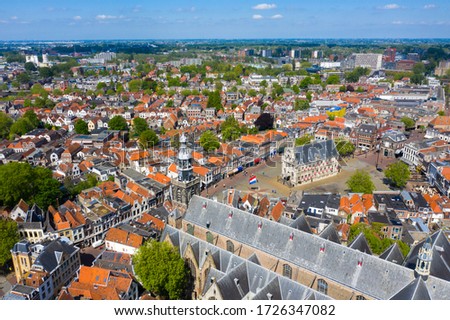 Aerial drone footage of the Dutch City Gouda where gouda cheese is made. city centre / center with lots of historical buildings and churches including the city hall and the cheese market. Stock photo © 