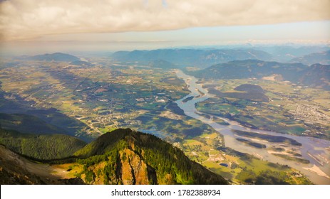 Aerial Drone Image Of A Beautiful Mountain View With The Valley And The Canadian Fraser River In The Background. View From Mt. Cheam, British Colombia.