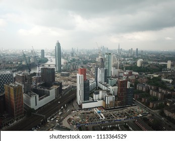 Aerial Drone Image Of London England And The River Thames On A Clear Sunny Day.  Skyscrapers Shape The London Skyline Looking East.