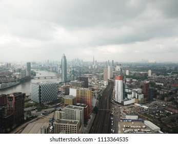 Aerial Drone Image Of London England And The River Thames On A Clear Sunny Day.  Skyscrapers Shape The London Skyline Looking East.