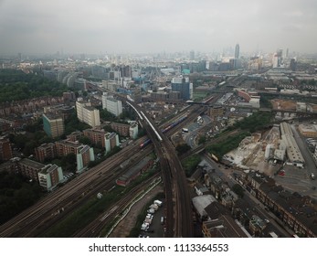 Aerial Drone Image Of London England And The River Thames On A Clear Sunny Day.  Skyscrapers Shape The London Skyline Looking East.