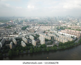 Aerial Drone Image Of London England And The River Thames On A Clear Sunny Day.  Skyscrapers Shape The London Skyline Looking East.