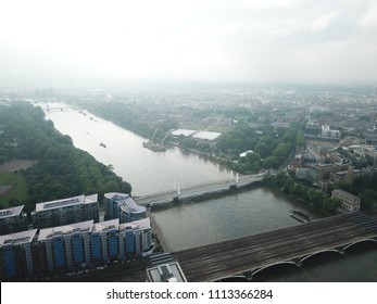 Aerial Drone Image Of London England And The River Thames On A Clear Sunny Day.  Skyscrapers Shape The London Skyline Looking East.