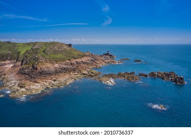 Aerial Drone Image Of Noirmont Point, Jersey Channel Islands With Blue Sky And Calm Sea