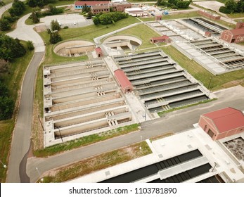 Aerial Drone Image, Top Down, Of A Water Reclamation Plant (sewage Treatment) With Bioreactors And Filtration Pools.