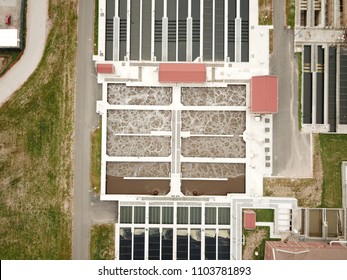 Aerial Drone Image, Top Down, Of A Water Reclamation Plant (sewage Treatment) With Bioreactors And Filtration Pools.