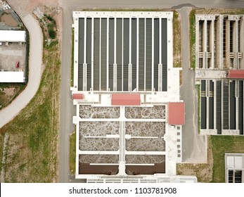 Aerial Drone Image, Top Down, Of A Water Reclamation Plant (sewage Treatment) With Bioreactors And Filtration Pools.