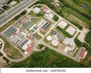 Aerial Drone Image, Top Down, Of A Water Reclamation Plant (sewage Treatment) With Bioreactors And Filtration Pools.