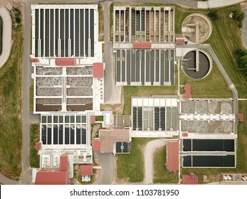 Aerial Drone Image, Top Down, Of A Water Reclamation Plant (sewage Treatment) With Bioreactors And Filtration Pools.