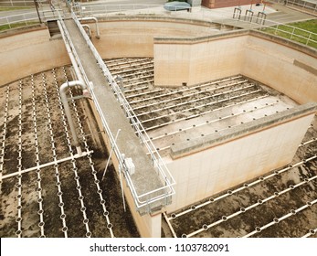 Aerial Drone Image, Top Down, Of A Water Reclamation Plant (sewage Treatment) With Bioreactors And Filtration Pools.