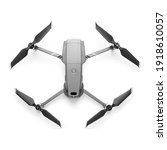Aerial Drone Isolated on White Background. Top View of Quad Copter with Digital Camera. Flying Remote Control Air Drone. Headless Quadcopter with 4K Hasselblad Camera and Remote Control