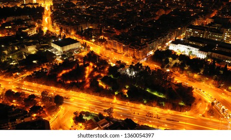 Aerial Drone Night Shot From Beautiful Illuminated City Of Athens At Night, Attica, Greece