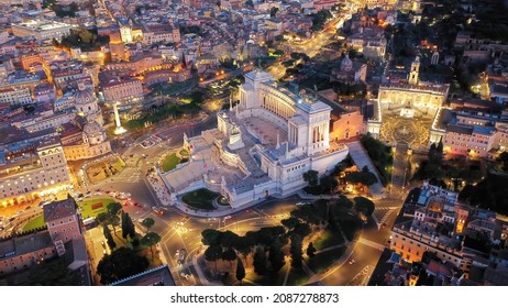 Aerial drone night shot of iconic monument in Venice square called Altar of the Fatherland at dusk with beautiful colours, Rome historic centre, Italy