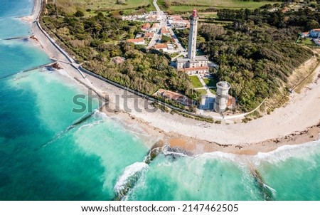 Aerial drone panorama shot of the Phare des Baleines or Lighthouse of the Whales taken from the sea on Ile de Ré or island of Re in France