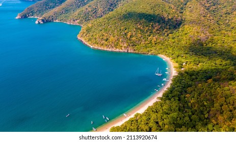 Aerial Drone Panorama View Of The Coast Line, Beach And Crystal Clear Water Of Santa Marta, Colombia