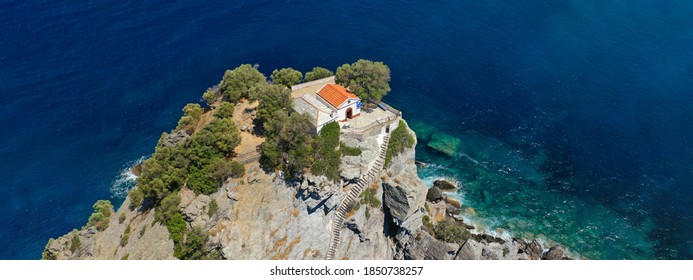 Aerial drone panoramic photo of picturesque chapel of Saint John built in famous cliff where Mamma Mia movie was filmed, Skopelos island, Sporades, Greece
