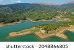 Aerial drone photo of beautiful artificial lake of Plastiras or Tavropos with wonderful nature and famous outdoor and water activities like canoe and water bike, Thessaly, Greece 